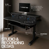 The Sound Town SDRK-SD1D is an electric standing studio desk in Black Espresso, designed for music production, streaming, podcasting, and home studios. With electric height adjustment, memory presets, integrated rack space, a sliding keyboard and MIDI tray, cable grommets, and headphone hooks, it keeps studio gear organized and within reach. Durable plywood construction and a reinforced iron base provide a stable setup for recording and production.